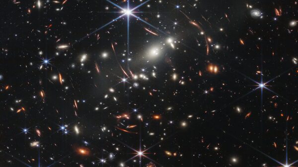 Telescópio da Nasa registra imagens inéditas de galáxias distantes Telescópio da Nasa registra imagens inéditas de galáxias distantes