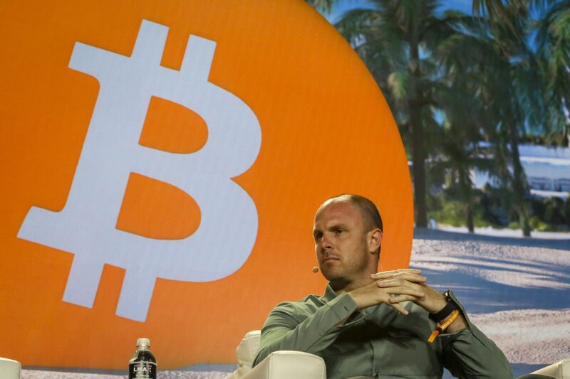 Jason Les, chief executive officer of Riot Platforms, listens during a conference in Miami. Jason Les, chief executive officer of Riot Platforms, listens during a conference in Miami.
