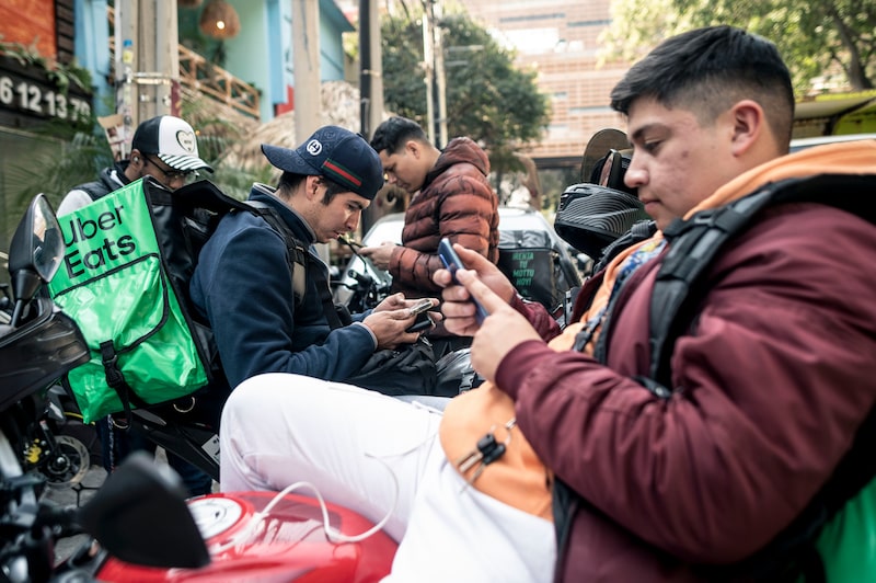 Delivery workers wait for orders in Mexico City, Mexico, on Thursday, Dec. 12, 2024. Mexico's Lower House of Congress approved the general text of one of the most aggressive labor reform bills in the world, which would give additional rights and benefits to gig workers employed at digital apps like Uber Technologies Inc. and Didi Global Inc. Photographer: Mayolo Lopez Gutierrez/Bloomberg Delivery workers wait for orders in Mexico City, Mexico, on Thursday, Dec. 12, 2024. Mexico's Lower House of Congress approved the general text of one of the most aggressive labor reform bills in the world, which would give additional rights and benefits to gig workers employed at digital apps like Uber Technologies Inc. and Didi Global Inc. Photographer: Mayolo Lopez Gutierrez/Bloomberg