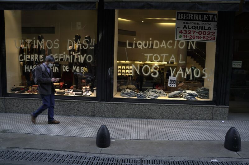 A store notifies customers of a liquidation sale before permanently closing in Buenos Aires, Argentina, on Thursday, July 7, 2022. Argentina's parallel exchange rate, untethered from the government's strict currency controls, has fallen 17% so far this week, prompting Buenos Aires shop owners to post signs announcing a 20% mark-up on all listed prices. A store notifies customers of a liquidation sale before permanently closing in Buenos Aires, Argentina, on Thursday, July 7, 2022. Argentina's parallel exchange rate, untethered from the government's strict currency controls, has fallen 17% so far this week, prompting Buenos Aires shop owners to post signs announcing a 20% mark-up on all listed prices.