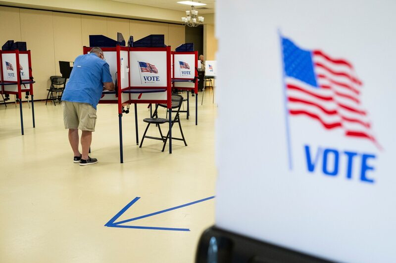 A voter casts their ballot at a polling station at the VFD Activities Building in Middletown, Maryland, US. A voter casts their ballot at a polling station at the VFD Activities Building in Middletown, Maryland, US.