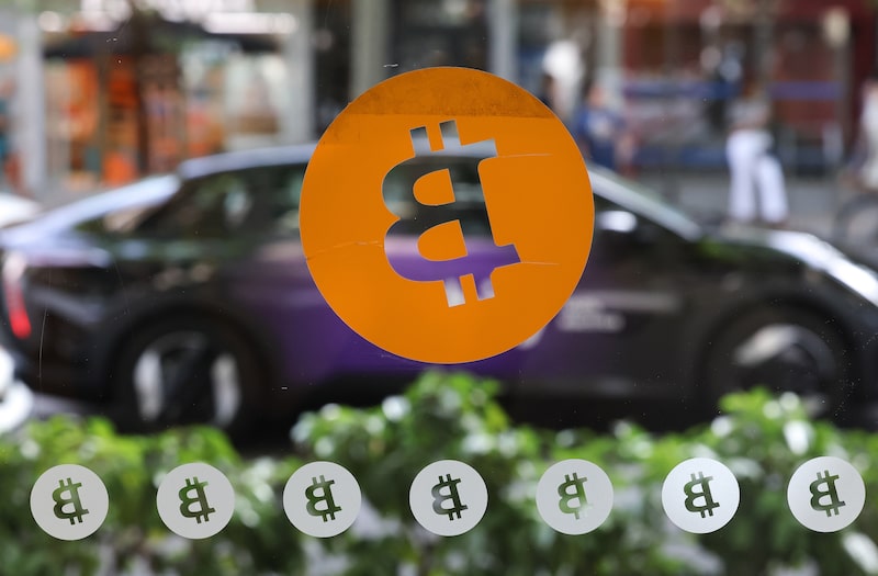A Bitcoin logo. A Bitcoin logo.