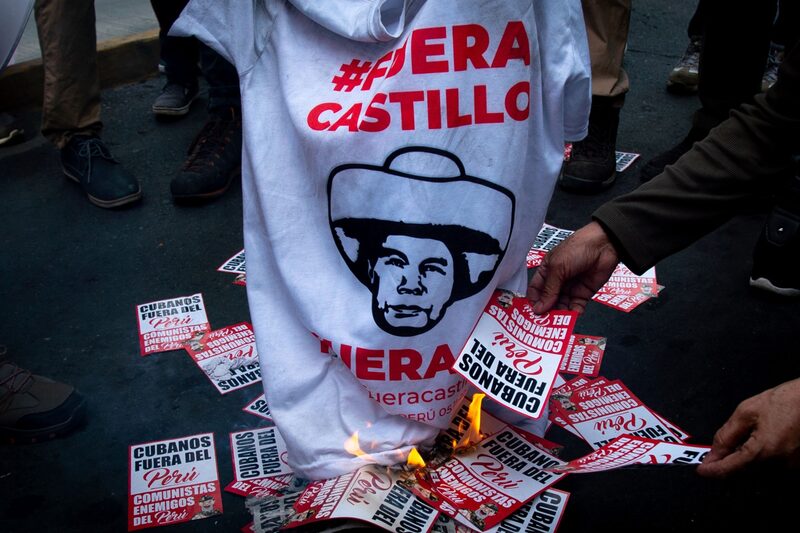 Demonstrators protest against Pedro Castillo, Peru's former president, following his impeachment and arrest, near the Lima Prefecture in Lima. Demonstrators protest against Pedro Castillo, Peru's former president, following his impeachment and arrest, near the Lima Prefecture in Lima.