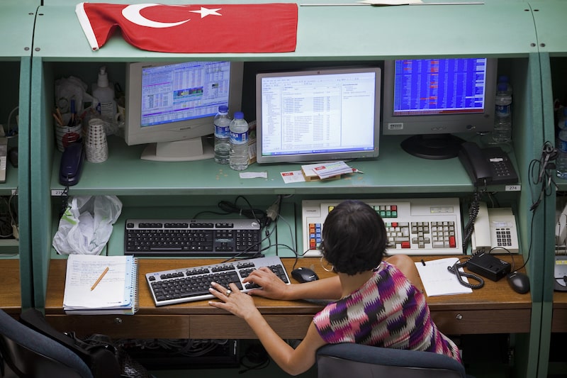 A trader works at her desk on the floor of the Istanbul stock exchange in Istanbul, Turkey, on Thursday, Aug. 4, 2011. Turkey's central bank unexpectedly cut its benchmark interest rate to a record low to shield the economy from the impact of the European debt crisis and slowing growth in the U.S. Photographer: Kerem Uzel/Bloomberg A trader works at her desk on the floor of the Istanbul stock exchange in Istanbul, Turkey, on Thursday, Aug. 4, 2011. Turkey's central bank unexpectedly cut its benchmark interest rate to a record low to shield the economy from the impact of the European debt crisis and slowing growth in the U.S. Photographer: Kerem Uzel/Bloomberg