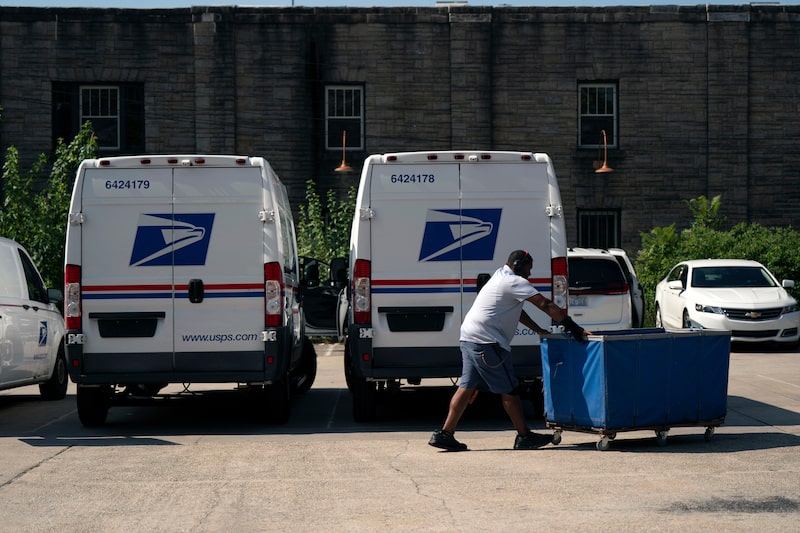 A United States Postal Service (USPS) worker Photographer: Allison Joyce/Bloomberg A United States Postal Service (USPS) worker Photographer: Allison Joyce/Bloomberg