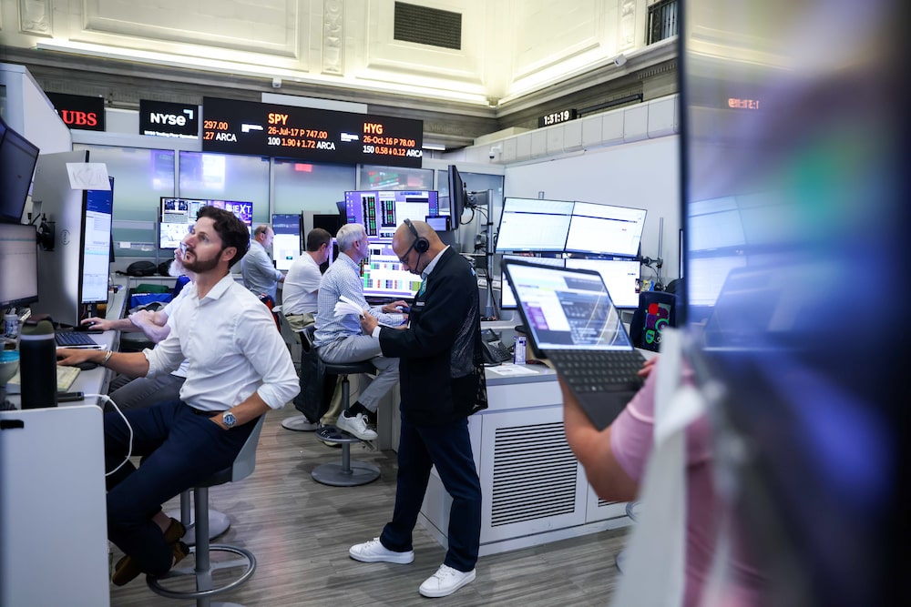 Traders work on the floor of the American Stock Exchange (AMEX) at the New York Stock Exchange (NYSE) in New York, US, on Tuesday, July 14, 2026. A cooler-than-estimated inflation reading spurred gains in both stocks and bonds, easing concern about imminent Federal Reserve interest-rate hikes amid a resurgence in oil prices. Photographer: Michael Nagle/Bloomberg Traders work on the floor of the American Stock Exchange (AMEX) at the New York Stock Exchange (NYSE) in New York, US, on Tuesday, July 14, 2026. A cooler-than-estimated inflation reading spurred gains in both stocks and bonds, easing concern about imminent Federal Reserve interest-rate hikes amid a resurgence in oil prices. Photographer: Michael Nagle/Bloomberg