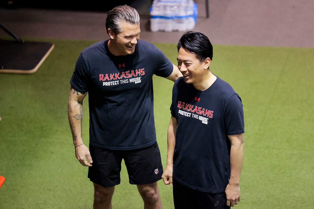 JOINT BASE MYER-HENDERSON HALL, VIRGINIA - JANUARY 15: U.S. Secretary of War Pete Hegseth (L) talks with Japanese Defense Minister Shinjirō Koizumi on January 15, 2026 in Joint Base Myer-Henderson Hall, Virginia. The two leaders spent their morning working out with members of the U.S. army in a friendly competition. (Photo by Heather Diehl/Getty Images) JOINT BASE MYER-HENDERSON HALL, VIRGINIA - JANUARY 15: U.S. Secretary of War Pete Hegseth (L) talks with Japanese Defense Minister Shinjirō Koizumi on January 15, 2026 in Joint Base Myer-Henderson Hall, Virginia. The two leaders spent their morning working out with members of the U.S. army in a friendly competition. (Photo by Heather Diehl/Getty Images)