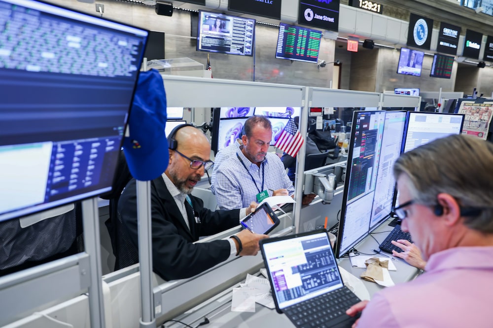 Traders work on the floor of the American Stock Exchange (AMEX) at the New York Stock Exchange (NYSE) in New York, US, on Tuesday, July 14, 2026. A cooler-than-estimated inflation reading spurred gains in both stocks and bonds, easing concern about imminent Federal Reserve interest-rate hikes amid a resurgence in oil prices. Photographer: Michael Nagle/Bloomberg Traders work on the floor of the American Stock Exchange (AMEX) at the New York Stock Exchange (NYSE) in New York, US, on Tuesday, July 14, 2026. A cooler-than-estimated inflation reading spurred gains in both stocks and bonds, easing concern about imminent Federal Reserve interest-rate hikes amid a resurgence in oil prices. Photographer: Michael Nagle/Bloomberg
