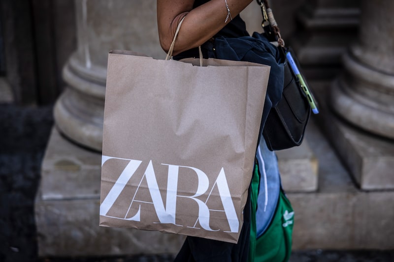 A customer with a Zara shopping bag on Passeig de Gracia in Barcelona, Spain. Photographer: Angel Garcia/Bloomberg A customer with a Zara shopping bag on Passeig de Gracia in Barcelona, Spain. Photographer: Angel Garcia/Bloomberg