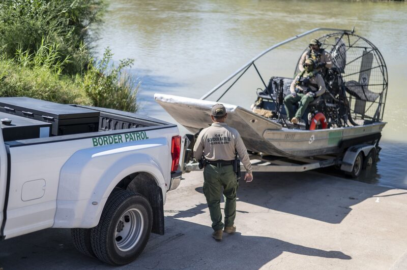 US Border Patrol agents prepare to go into the Rio Grande in Eagle Pass, Texas. US Border Patrol agents prepare to go into the Rio Grande in Eagle Pass, Texas.