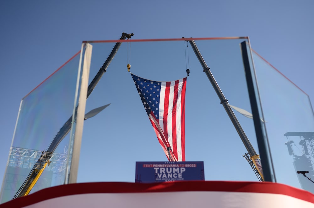 Bullet proof glass that surrounds the podium ahead of a campaign event with former US President Donald Trump, not pictured, at the Butler Farm Show in Butler, Pennsylvania, US, on Saturday, Oct. 5, 2024. Elon Musk will campaign with the former president on Saturday, joining a rally at the scene of a summer assassination attempt and cementing his role as one of the Republican candidate's key backers. Photographer: Justin Merriman/Bloomberg Bullet proof glass that surrounds the podium ahead of a campaign event with former US President Donald Trump, not pictured, at the Butler Farm Show in Butler, Pennsylvania, US, on Saturday, Oct. 5, 2024. Elon Musk will campaign with the former president on Saturday, joining a rally at the scene of a summer assassination attempt and cementing his role as one of the Republican candidate's key backers. Photographer: Justin Merriman/Bloomberg