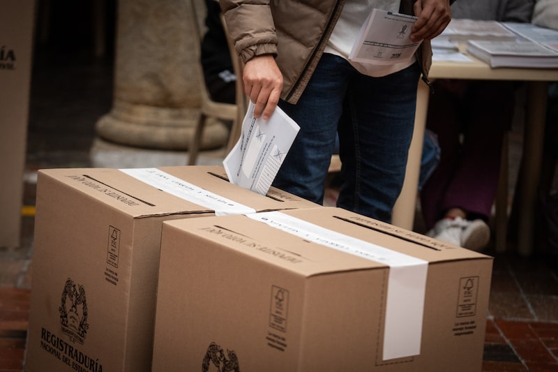 A voter casts a ballot at a polling station during the Colombia parliamentary and primary elections in Bogota, Colombia, on Sunday, March 8, 2026. Colombia's fractured political landscape heads into March 8 congressional elections and inter-party presidential primaries that will shape the political map ahead of a tightly contested presidential race on May 31, with a likely runoff on June 21. Photographer: Nathalia Angarita/Bloomberg A voter casts a ballot at a polling station during the Colombia parliamentary and primary elections in Bogota, Colombia, on Sunday, March 8, 2026. Colombia's fractured political landscape heads into March 8 congressional elections and inter-party presidential primaries that will shape the political map ahead of a tightly contested presidential race on May 31, with a likely runoff on June 21. Photographer: Nathalia Angarita/Bloomberg