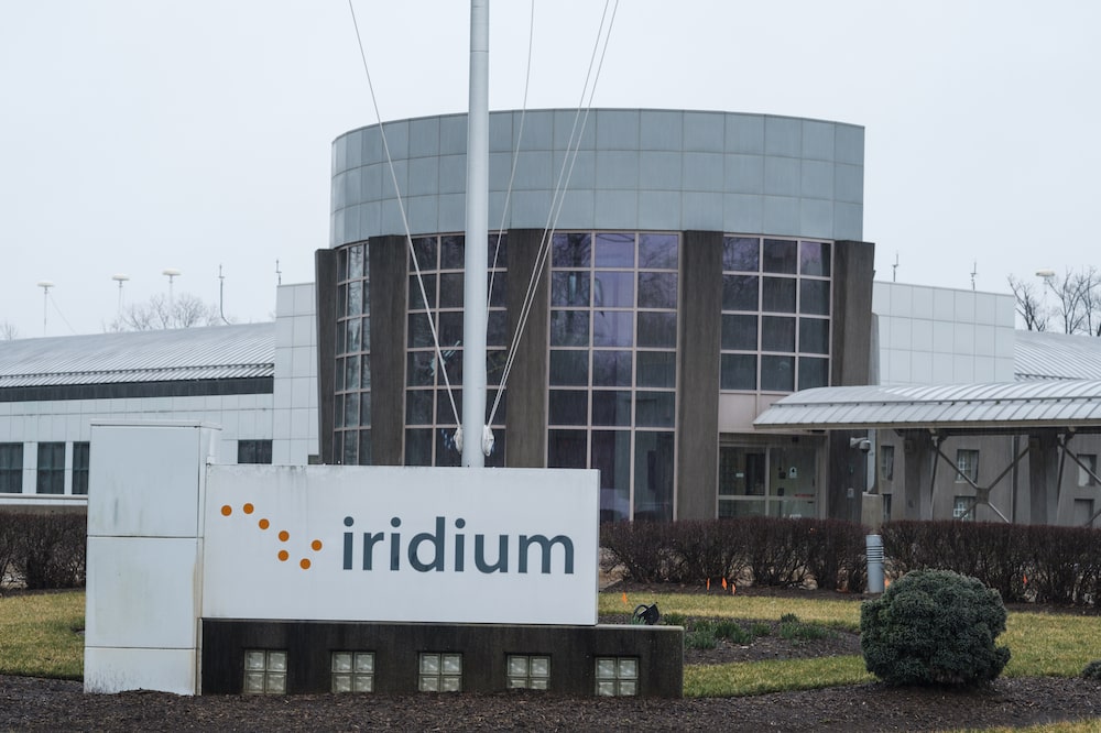 Signage stands on display outside the Iridium Communications Inc. Satellite Network Operations Center (SNOC) in Leesburg, Virginia, U.S., on Thursday, March 21, 2019. A new satellite network capable of tracking planes in high fidelity across the globe captured the flight path of the Boeing Co. 737 Max that crashed on March 10. The data was provided by Aireon LLC, which was formed in 2012 by Iridium Communications Inc. and Nav Canada in 2012. Photographer: Justin Ide/Bloomberg Signage stands on display outside the Iridium Communications Inc. Satellite Network Operations Center (SNOC) in Leesburg, Virginia, U.S., on Thursday, March 21, 2019. A new satellite network capable of tracking planes in high fidelity across the globe captured the flight path of the Boeing Co. 737 Max that crashed on March 10. The data was provided by Aireon LLC, which was formed in 2012 by Iridium Communications Inc. and Nav Canada in 2012. Photographer: Justin Ide/Bloomberg