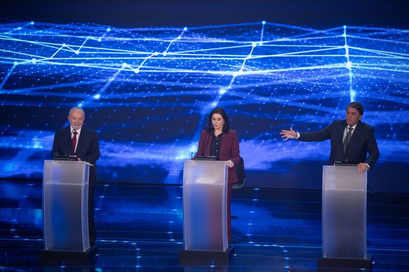 Luiz Inacio Lula da Silva, Brazil's former president, from left, Simone Tebet, presidential candidate for the Brazilian Democratic Movement Party, and Jair Bolsonaro, Brazil's president, during the first televised presidential debate in Sao Paulo, Brazil, on Sunday, Aug. 28, 2022. Luiz Inacio Lula da Silva, Brazil's former president, from left, Simone Tebet, presidential candidate for the Brazilian Democratic Movement Party, and Jair Bolsonaro, Brazil's president, during the first televised presidential debate in Sao Paulo, Brazil, on Sunday, Aug. 28, 2022.