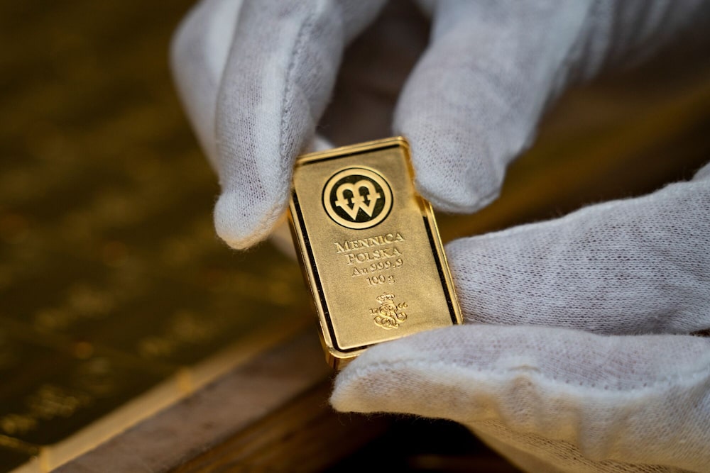 Un lingote de oro de 100 gramos acuñado en la Casa de la Moneda polaca, también conocida como Mennica Polska SA, en Varsovia, Polonia, el jueves 12 de febrero de 2026. Un lingote de oro de 100 gramos acuñado en la Casa de la Moneda polaca, también conocida como Mennica Polska SA, en Varsovia, Polonia, el jueves 12 de febrero de 2026.