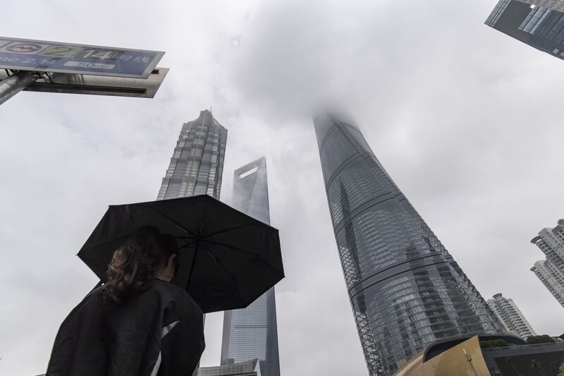 A pedestrian crosses a road in Pudong's Lujiazui Financial District in Shanghai, China, on Saturday, May 11, 2024. China plans to start selling the first batch of its 1 trillion yuan ($138 billion) of ultra-long special central government bonds on Friday, according to people familiar with the matter, as it seeks to raise funds to support the worlds second-biggest economy. Photographer: Qilai Shen/Bloomberg A pedestrian crosses a road in Pudong's Lujiazui Financial District in Shanghai, China, on Saturday, May 11, 2024. China plans to start selling the first batch of its 1 trillion yuan ($138 billion) of ultra-long special central government bonds on Friday, according to people familiar with the matter, as it seeks to raise funds to support the worlds second-biggest economy. Photographer: Qilai Shen/Bloomberg
