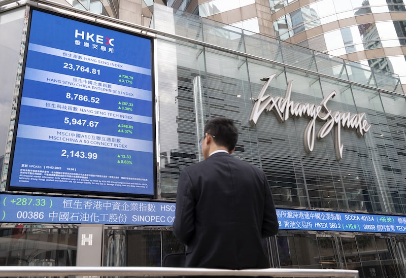 An electronic screen and ticker at the Exchange Square Complex, which houses the Hong Kong Stock Exchange, in Hong Kong. Photographer: Yik Yeung-man/Bloomberg An electronic screen and ticker at the Exchange Square Complex, which houses the Hong Kong Stock Exchange, in Hong Kong. Photographer: Yik Yeung-man/Bloomberg