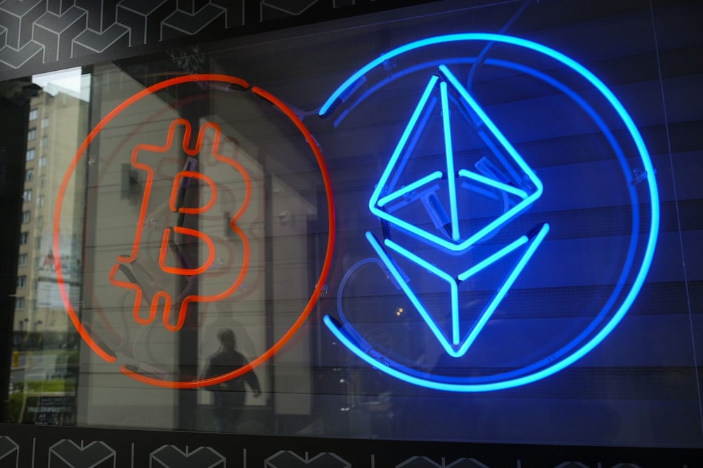 The neon logos of Bitcoin and Ethereum cryptocurrencies in the window of a crypto exchange in Warsaw, Poland, on Thursday, March 14, 2024. Bitcoin extended a retreat from its latest record high amid an intensifying debate about whether the bull run in cryptocurrencies is evidence of speculative froth in global markets. The neon logos of Bitcoin and Ethereum cryptocurrencies in the window of a crypto exchange in Warsaw, Poland, on Thursday, March 14, 2024. Bitcoin extended a retreat from its latest record high amid an intensifying debate about whether the bull run in cryptocurrencies is evidence of speculative froth in global markets.