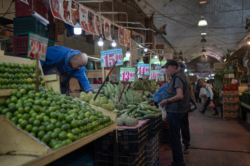 Shoppers browse produce at the La Merced market in Mexico City, Mexico, on Thursday, Feb. 8, 2024. Mexico's central bank is expected to hold the benchmark rate at 11.25% for a seventh consecutive meeting as accelerating non-core inflation rises due to higher food and energy prices. Photographer: Victoria Razo/Bloomberg Shoppers browse produce at the La Merced market in Mexico City, Mexico, on Thursday, Feb. 8, 2024. Mexico's central bank is expected to hold the benchmark rate at 11.25% for a seventh consecutive meeting as accelerating non-core inflation rises due to higher food and energy prices. Photographer: Victoria Razo/Bloomberg