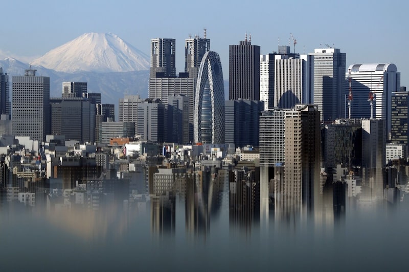 Mount Fuji and buildings in the Shinjuku district in Tokyo. Photographer: Kiyoshi Ota/Bloomberg Mount Fuji and buildings in the Shinjuku district in Tokyo. Photographer: Kiyoshi Ota/Bloomberg