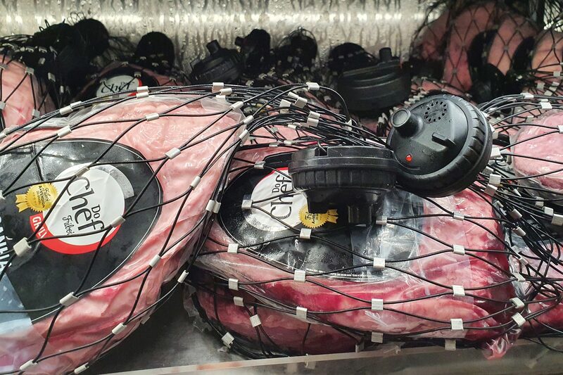 Security sensors on meat at a supermarket in Brasilia. Security sensors on meat at a supermarket in Brasilia.