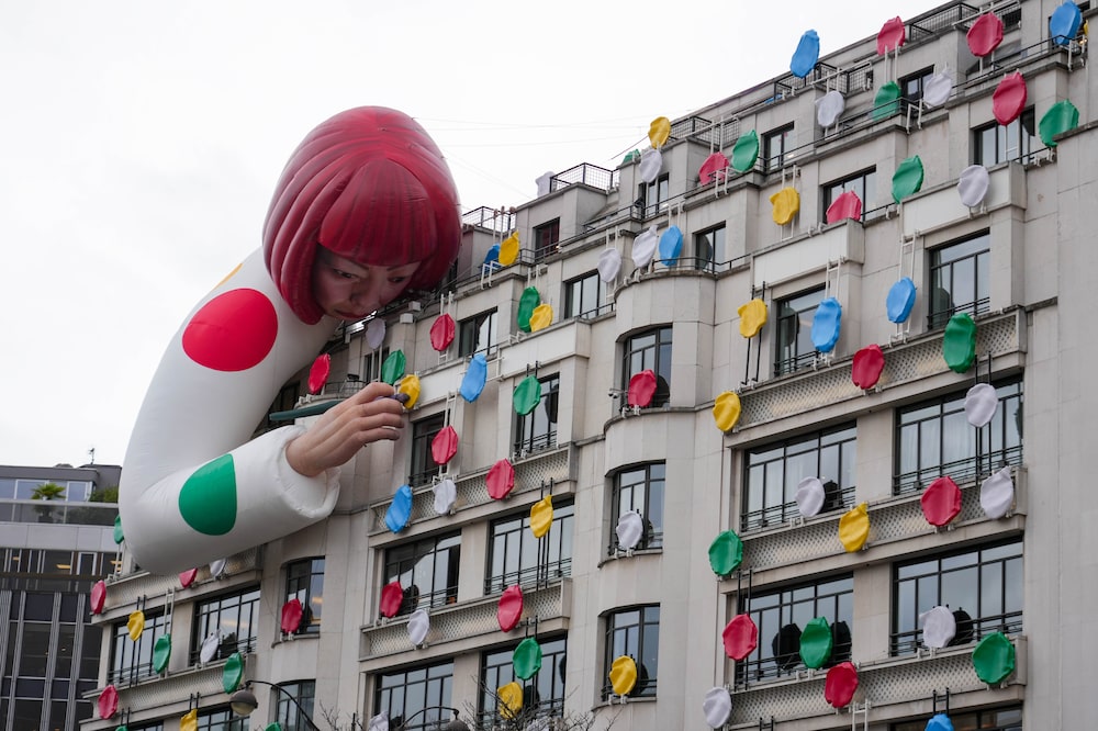 Yayoi Kusama Sculpture Is Displayed On the Top Of The Louis Vuitton's Champs Elysees Store Yayoi Kusama Sculpture Is Displayed On the Top Of The Louis Vuitton's Champs Elysees Store