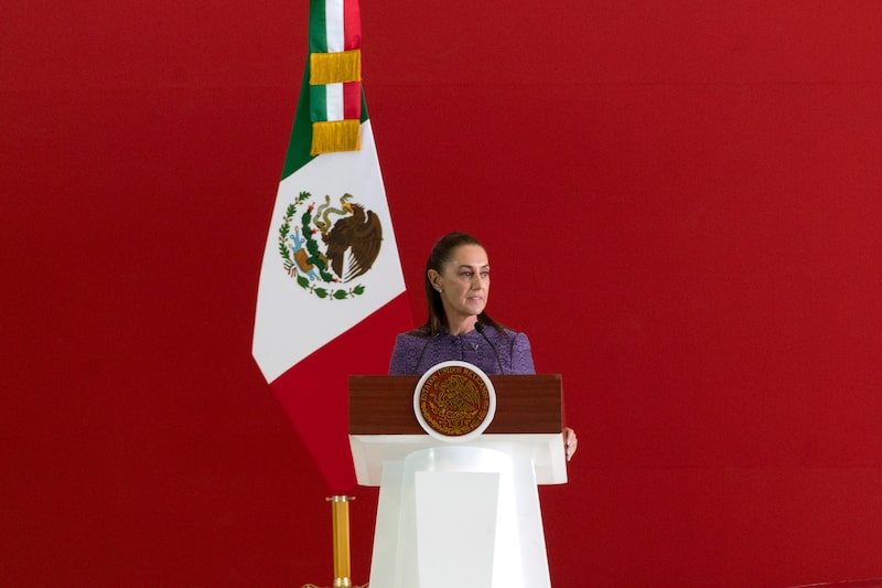 Claudia Sheinbaum, Mexico's president, speaks during an unveiling event for the Olinia Uno electric vehicle (EV) at the Santa Lucia military base in Mexico City, Mexico, on Sunday, June 7, 2026. Mexico's mini electric vehicle startup Olinia unveiled its first prototype in a ceremony presided over by the country's president who praised the initiative as an affordable solution that showcases homegrown ingenuity. Photographer: Stephania Corpi/Bloomberg Claudia Sheinbaum, Mexico's president, speaks during an unveiling event for the Olinia Uno electric vehicle (EV) at the Santa Lucia military base in Mexico City, Mexico, on Sunday, June 7, 2026. Mexico's mini electric vehicle startup Olinia unveiled its first prototype in a ceremony presided over by the country's president who praised the initiative as an affordable solution that showcases homegrown ingenuity. Photographer: Stephania Corpi/Bloomberg