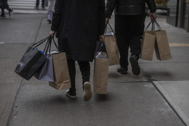 Shoppers make their way down Fifth Avenue in New York, New York, U.S., on Monday, December 27, 2021. Holiday shoppers took advantage of after Christmas sales as inflation continues to rise. Photographer: Victor J. Blue/Bloomberg Shoppers make their way down Fifth Avenue in New York, New York, U.S., on Monday, December 27, 2021. Holiday shoppers took advantage of after Christmas sales as inflation continues to rise. Photographer: Victor J. Blue/Bloomberg
