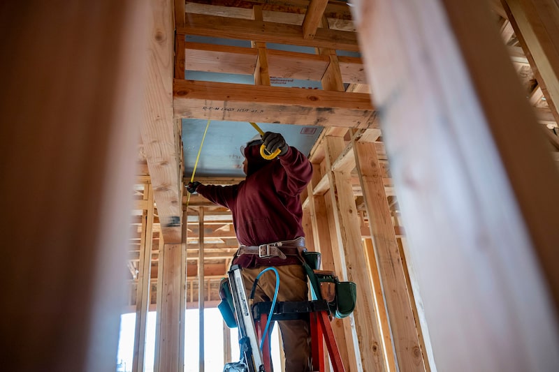 A contractor works in a property under construction in Folsom, California. A contractor works in a property under construction in Folsom, California.
