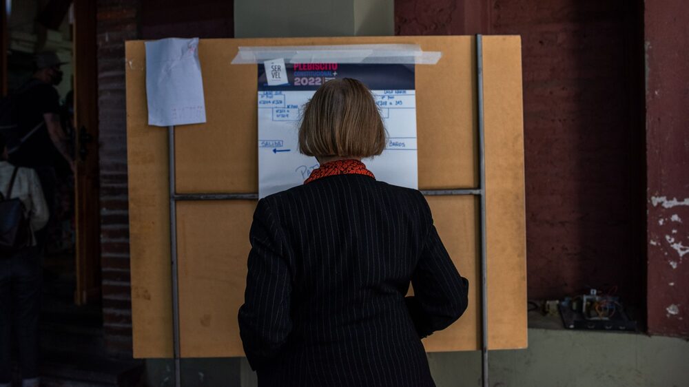 A voter casts a ballot at a polling station during a national constitutional referendum in Santiago, Chile, on Sunday, Sept. 4, 2022. Chileans are heading to the polls for a referendum on a new constitution that prioritizes social rights and the environment, potentially steering a global investor favorite further away from its pro-market ethos. Photographer: Cristobal Olivares/Bloomberg A voter casts a ballot at a polling station during a national constitutional referendum in Santiago, Chile, on Sunday, Sept. 4, 2022. Chileans are heading to the polls for a referendum on a new constitution that prioritizes social rights and the environment, potentially steering a global investor favorite further away from its pro-market ethos. Photographer: Cristobal Olivares/Bloomberg