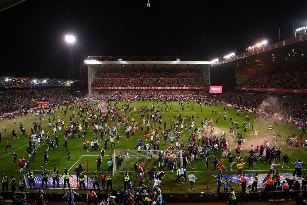 Nottingham Forest fans invade the pitch after securing their place in the final by beating Sheffield United at City Ground in Nottingham, UK on May 17. Photographer: Michael Regan/Getty Images Nottingham Forest fans invade the pitch after securing their place in the final by beating Sheffield United at City Ground in Nottingham, UK on May 17. Photographer: Michael Regan/Getty Images