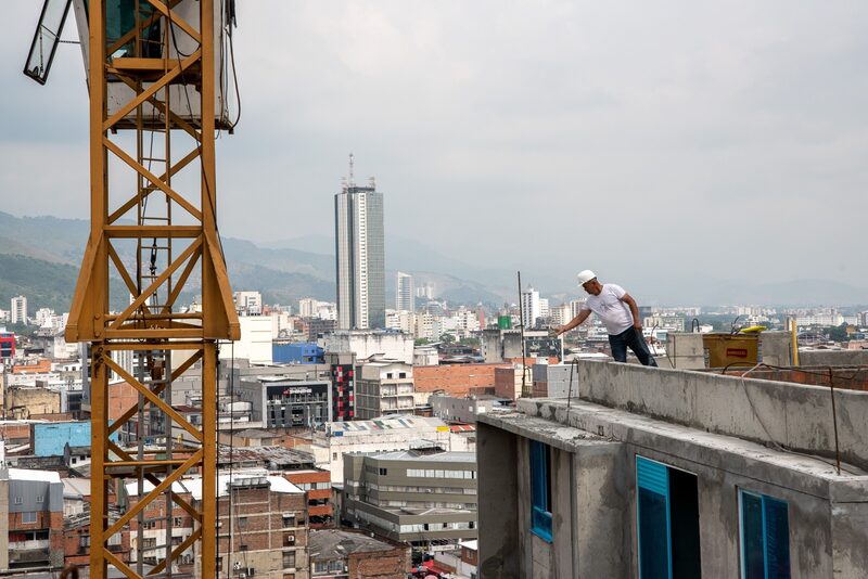 A worker on the terrace of a building at the Paraiso Central housing project under construction in Cali, Colombia. A worker on the terrace of a building at the Paraiso Central housing project under construction in Cali, Colombia.