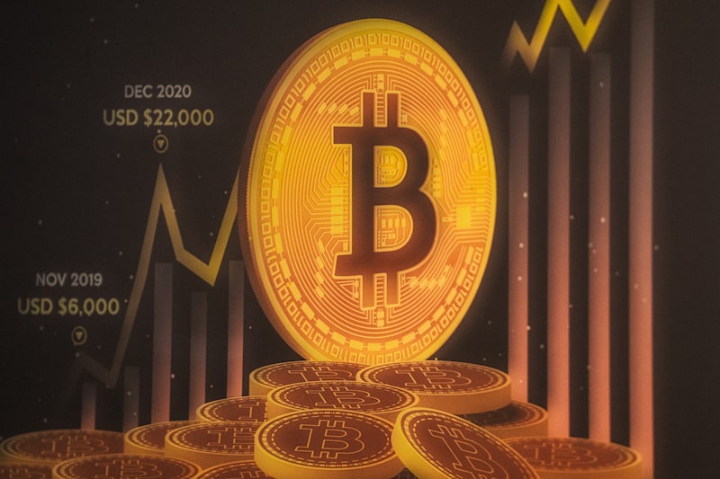 Signage for Bitcoin cryptocurrency Photographer: Lam Yik/Bloomberg Signage for Bitcoin cryptocurrency Photographer: Lam Yik/Bloomberg