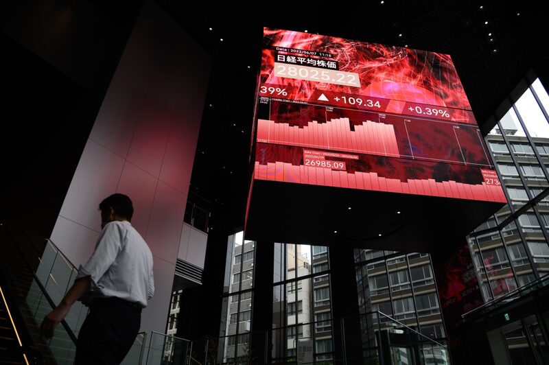 The Nikkei 225 Stock Average displayed on a rotating-cube screen in an atrium of the Kabuto One building, next the Tokyo Stock Exchange, in Tokyo. The Nikkei 225 Stock Average displayed on a rotating-cube screen in an atrium of the Kabuto One building, next the Tokyo Stock Exchange, in Tokyo.