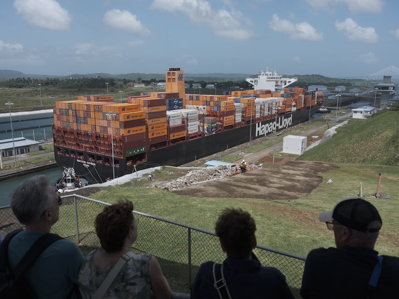 Tourists watch a Hapag-Lloyd container ship in the Agua Clara Locks near Coln, Panama, Tourists watch a Hapag-Lloyd container ship in the Agua Clara Locks near Coln, Panama,