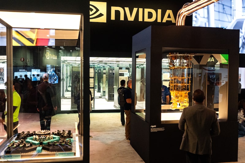 Attendees at the Nvidia booth during the Nvidia GTC (GPU Technology Conference) in Washington, DC, US, on Wednesday, Oct. 29, 2025. Nvidia Corp. achieved a historic $5 trillion market capitalization on Wednesday as Chief Executive Officer Jensen Huang's spree of deals catapults the artificial intelligence frenzy to new heights. Photographer: Kent Nishimura/Bloomberg Attendees at the Nvidia booth during the Nvidia GTC (GPU Technology Conference) in Washington, DC, US, on Wednesday, Oct. 29, 2025. Nvidia Corp. achieved a historic $5 trillion market capitalization on Wednesday as Chief Executive Officer Jensen Huang's spree of deals catapults the artificial intelligence frenzy to new heights. Photographer: Kent Nishimura/Bloomberg