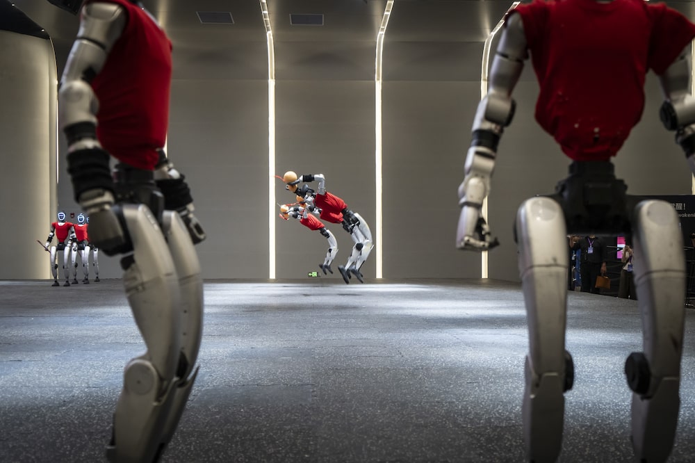 Unitree Robotics G1 humanoid robots during a martial arts demonstration at the company's headquarters in Hangzhou, China, on Tuesday, June 2, 2026. China is pitching itself as the global fulcrum for the next phase of artificial intelligence and a legion of robotics companies is lining up initial public offerings to test investor appetite. Photographer: Qilai Shen/Bloomberg Unitree Robotics G1 humanoid robots during a martial arts demonstration at the company's headquarters in Hangzhou, China, on Tuesday, June 2, 2026. China is pitching itself as the global fulcrum for the next phase of artificial intelligence and a legion of robotics companies is lining up initial public offerings to test investor appetite. Photographer: Qilai Shen/Bloomberg