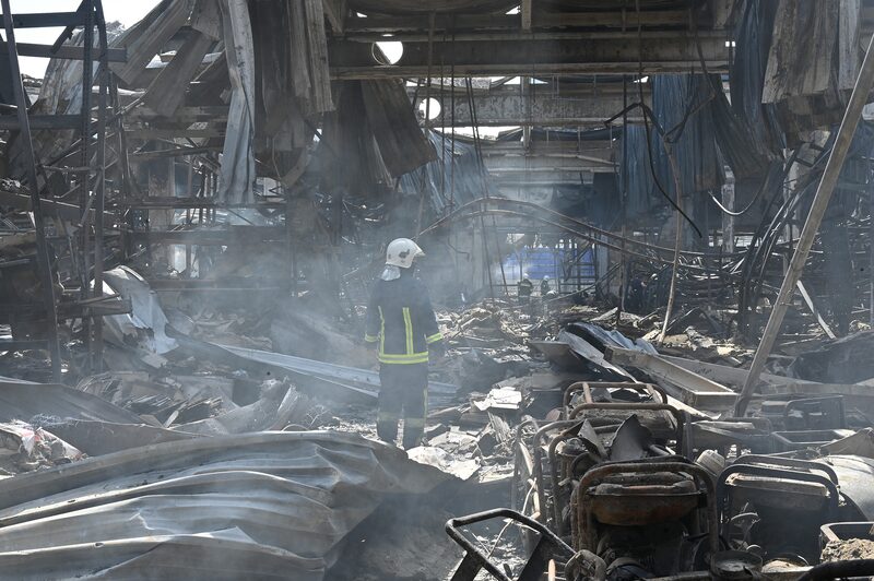 TOPSHOT - An employee of the State Emergency Service of Ukraine stands in the middle of debris in a hardware supermarket in Kharkiv destroyed by a Russian strike, on May 26, 2024, amid the Russian invasion in Ukraine. The death toll from a Russian strike on a hardware superstore in the eastern Ukrainian city of Kharkiv rose to 12 Sunday, the interior minister said, with President Volodymyr Zelensky condemning the attack as "vile". (Photo by SERGEY BOBOK / AFP) (Photo by SERGEY BOBOK/AFP via Getty Images) TOPSHOT - An employee of the State Emergency Service of Ukraine stands in the middle of debris in a hardware supermarket in Kharkiv destroyed by a Russian strike, on May 26, 2024, amid the Russian invasion in Ukraine. The death toll from a Russian strike on a hardware superstore in the eastern Ukrainian city of Kharkiv rose to 12 Sunday, the interior minister said, with President Volodymyr Zelensky condemning the attack as "vile". (Photo by SERGEY BOBOK / AFP) (Photo by SERGEY BOBOK/AFP via Getty Images)