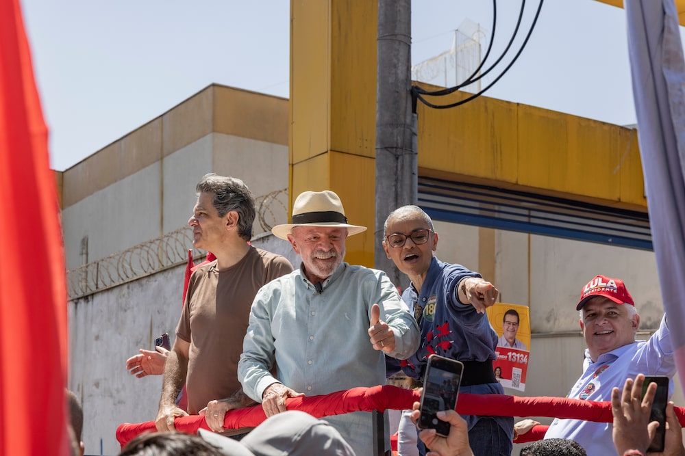 Luiz Inacio Lula da Silva, Brazil's president, center, Marina Silva, candidate for the Federal Senate, right, and Fernando Haddad, gubernatorial candidate for Sao Paulo, left, during a campaign rally in Sao Paulo, Brazil, on Saturday, Sep. 26, 2026. President Lula and Flavio Bolsonaro are deadlocked less than two weeks before Brazil's election, a new poll showed, following fresh revelations about the challenger's ties to a jailed banker at the center of a massive fraud scheme. Photographer: Photographer: Victor Moriyama/Bloomberg Luiz Inacio Lula da Silva, Brazil's president, center, Marina Silva, candidate for the Federal Senate, right, and Fernando Haddad, gubernatorial candidate for Sao Paulo, left, during a campaign rally in Sao Paulo, Brazil, on Saturday, Sep. 26, 2026. President Lula and Flavio Bolsonaro are deadlocked less than two weeks before Brazil's election, a new poll showed, following fresh revelations about the challenger's ties to a jailed banker at the center of a massive fraud scheme. Photographer: Photographer: Victor Moriyama/Bloomberg