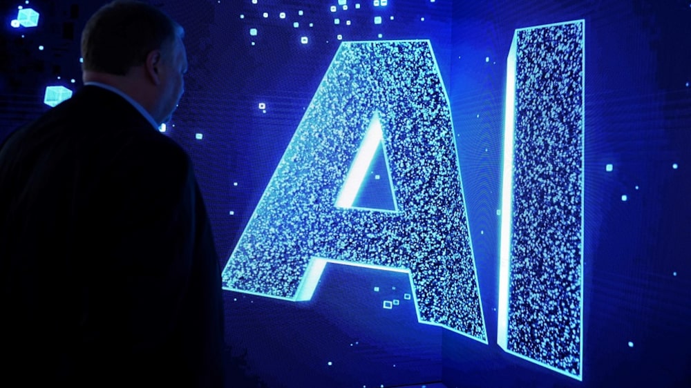 A visitor watches an AI (Artificial Intelligence) sign on an animated screen at the Mobile World Congress (MWC), the telecom industry's biggest annual gathering, in Barcelona. (Photo by Josep LAGO / AFP) (Photo by JOSEP LAGO/AFP via Getty Images) A visitor watches an AI (Artificial Intelligence) sign on an animated screen at the Mobile World Congress (MWC), the telecom industry's biggest annual gathering, in Barcelona. (Photo by Josep LAGO / AFP) (Photo by JOSEP LAGO/AFP via Getty Images)