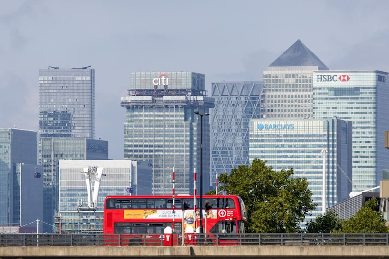 A London bus crosses a bridge near to London City Airport Ltd. in view of the Canary Wharf business, financial and shopping district, in London, UK, on Thursday, Aug. 14, 2025. Macquarie Asset Management, via Macquarie European Infrastructure Fund 7, is set to buy a 25% stake in London City Airport. Photographer: Chris Ratcliffe/Bloomberg A London bus crosses a bridge near to London City Airport Ltd. in view of the Canary Wharf business, financial and shopping district, in London, UK, on Thursday, Aug. 14, 2025. Macquarie Asset Management, via Macquarie European Infrastructure Fund 7, is set to buy a 25% stake in London City Airport. Photographer: Chris Ratcliffe/Bloomberg