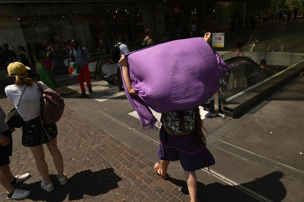 A pedestrian uses a shawl to shield from the sun during high temperatures in Paris, France, on Friday, June 26, 2026. The intense and unusually early heat underscores how climate change is transforming summers in the worlds fastest-warming continent. Photographer: Benjamin Girette/Bloomberg A pedestrian uses a shawl to shield from the sun during high temperatures in Paris, France, on Friday, June 26, 2026. The intense and unusually early heat underscores how climate change is transforming summers in the worlds fastest-warming continent. Photographer: Benjamin Girette/Bloomberg