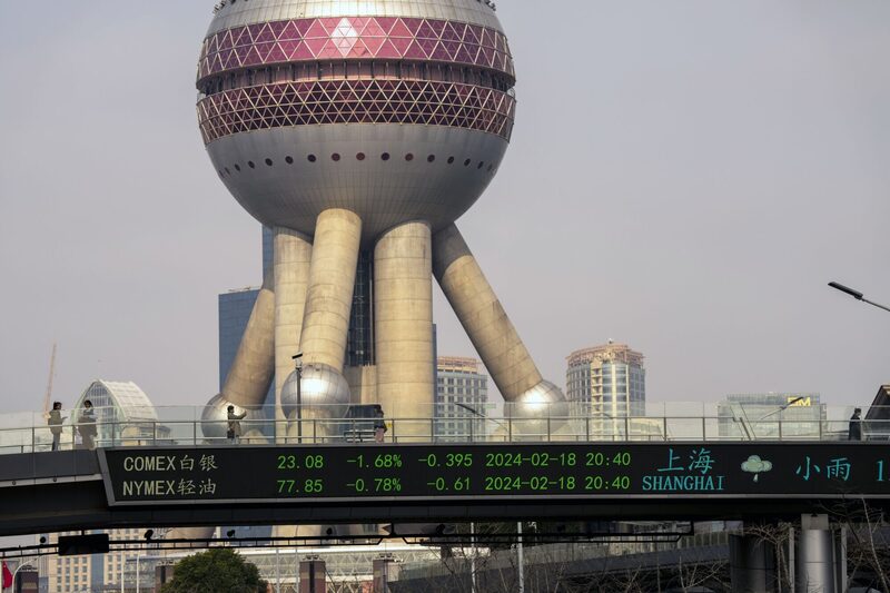 An electronic ticker displays stock figures in Pudong's Lujiazui Financial District in Shanghai, China, on Monday, Feb. 19, 2024. Chinese stocks saw modest gains as onshore traders returned from the Lunar New Year holidays, with broader caution toward the market offsetting buoyant travel and spending data. Photographer: Raul Ariano/Bloomberg An electronic ticker displays stock figures in Pudong's Lujiazui Financial District in Shanghai, China, on Monday, Feb. 19, 2024. Chinese stocks saw modest gains as onshore traders returned from the Lunar New Year holidays, with broader caution toward the market offsetting buoyant travel and spending data. Photographer: Raul Ariano/Bloomberg