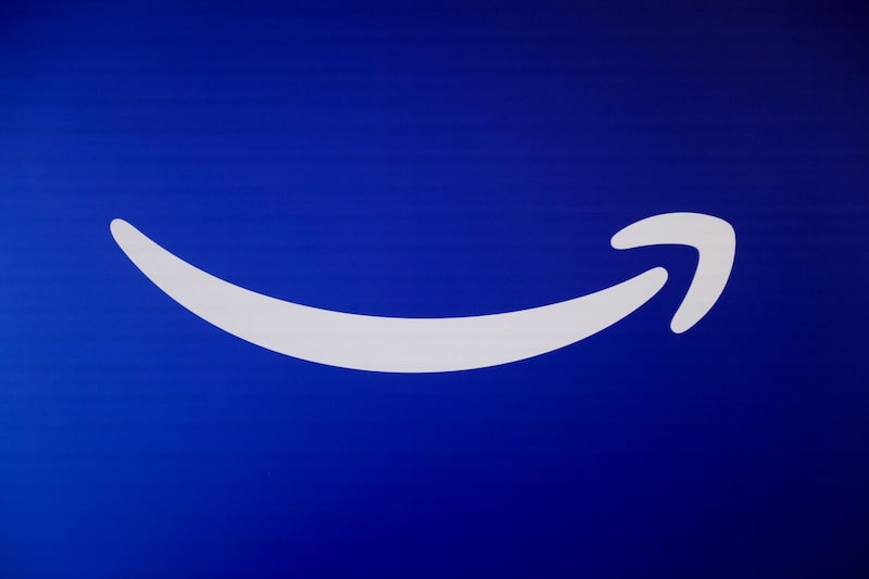 The Amazon logo during an unveiling event in New York, US, on Wednesday, Feb. 26, 2025. Amazon has rebooted Alexa with artificial intelligence, marking the biggest overhaul of the voice-activated assistant since its introduction over a decade ago. Photographer: Michael Nagle/Bloomberg The Amazon logo during an unveiling event in New York, US, on Wednesday, Feb. 26, 2025. Amazon has rebooted Alexa with artificial intelligence, marking the biggest overhaul of the voice-activated assistant since its introduction over a decade ago. Photographer: Michael Nagle/Bloomberg