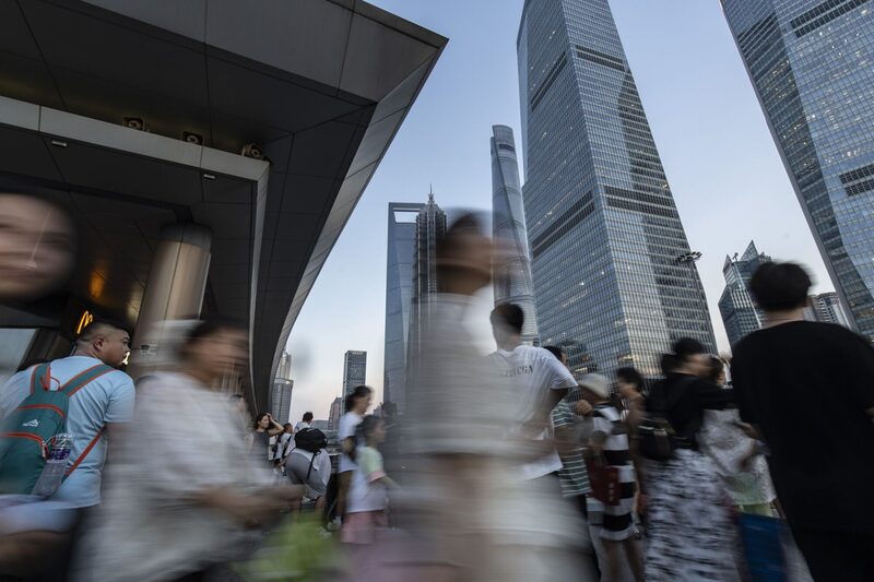 Pedestrians in Pudong's Lujiazui Financial District in Shanghai, China, on Wednesday, Aug. 7, 2024. The People's Bank of China is potentially getting the respite it’s been hoping for from global financial markets, bringing closer a dose of monetary stimulus long awaited by investors and traders. Photographer: Qilai Shen/Bloomberg Pedestrians in Pudong's Lujiazui Financial District in Shanghai, China, on Wednesday, Aug. 7, 2024. The People's Bank of China is potentially getting the respite it’s been hoping for from global financial markets, bringing closer a dose of monetary stimulus long awaited by investors and traders. Photographer: Qilai Shen/Bloomberg
