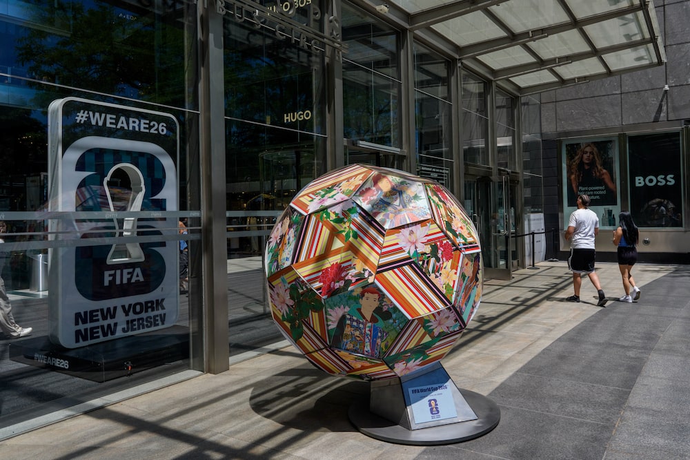 Signage and a football art piece for the FIFA World Cup at The Shops at Columbus Circle in New York, US, on Thursday, June 4, 2026. New Jersey Transit will reduce its controversial $150 World Cup ticket price to $105 after widespread pushback. Photographer: Adam Gray/Bloomberg Signage and a football art piece for the FIFA World Cup at The Shops at Columbus Circle in New York, US, on Thursday, June 4, 2026. New Jersey Transit will reduce its controversial $150 World Cup ticket price to $105 after widespread pushback. Photographer: Adam Gray/Bloomberg
