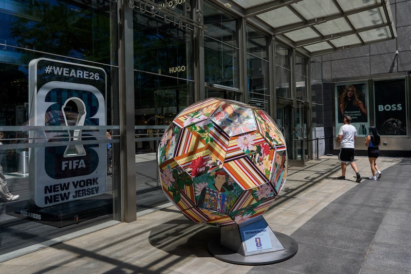 Signage and a football art piece for the FIFA World Cup at The Shops at Columbus Circle in New York, US, on Thursday, June 4, 2026. New Jersey Transit will reduce its controversial $150 World Cup ticket price to $105 after widespread pushback. Photographer: Adam Gray/Bloomberg Signage and a football art piece for the FIFA World Cup at The Shops at Columbus Circle in New York, US, on Thursday, June 4, 2026. New Jersey Transit will reduce its controversial $150 World Cup ticket price to $105 after widespread pushback. Photographer: Adam Gray/Bloomberg