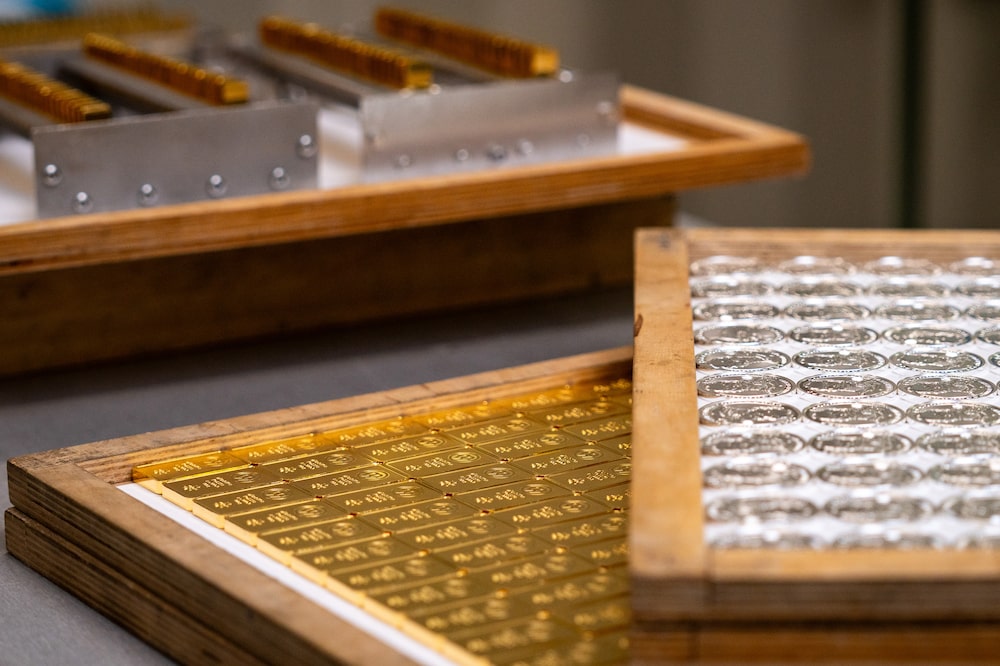 Trays of silver coins and gold bars at the Polish mint, also known as Mennica Polska SA, in Warsaw, Poland, on Thursday, Feb. 12, 2026. Polands central bank, the worlds biggest reported buyer of gold, is boosting purchases by another 150 tons as it braces for more of the geopolitical instability that has driven prices to record highs. Photographer: Damian Lemanski/Bloomberg Trays of silver coins and gold bars at the Polish mint, also known as Mennica Polska SA, in Warsaw, Poland, on Thursday, Feb. 12, 2026. Polands central bank, the worlds biggest reported buyer of gold, is boosting purchases by another 150 tons as it braces for more of the geopolitical instability that has driven prices to record highs. Photographer: Damian Lemanski/Bloomberg