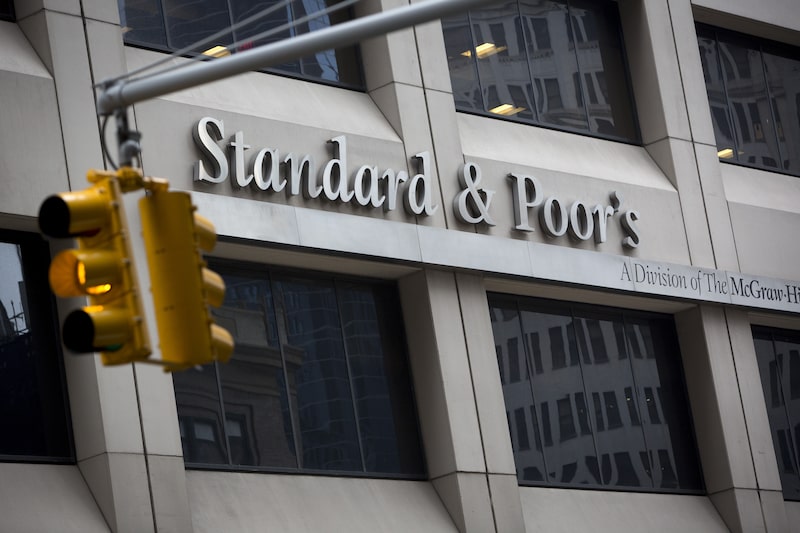 The Standard & Poor's logo is displayed at the company's headquarters in New York, U.S., on Tuesday, Feb. 5, 2013. The U.S. is seeking as much as $5 billion in penalties from McGraw-Hill Cos. and its Standard & Poor's unit to punish it for inflated credit ratings that Attorney General Eric Holder said were central to the worst financial crisis since the Great Depression. Photographer: Scott Eells/Bloomberg The Standard & Poor's logo is displayed at the company's headquarters in New York, U.S., on Tuesday, Feb. 5, 2013. The U.S. is seeking as much as $5 billion in penalties from McGraw-Hill Cos. and its Standard & Poor's unit to punish it for inflated credit ratings that Attorney General Eric Holder said were central to the worst financial crisis since the Great Depression. Photographer: Scott Eells/Bloomberg