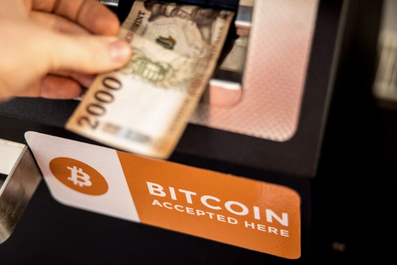 A customer deposits a Hungarian twenty thousand forint banknote into a cryptocurrency automated teller machine (ATM) in Budapest, Hungary, on Friday, Feb. 18, 2022. Bitcoin is testing $40,000, a key psychological level, as the U.S. plan talks with Russia about military intelligence that suggests an imminent Ukraine invasion, which it denies. Photographer: Akos Stiller/Bloomberg A customer deposits a Hungarian twenty thousand forint banknote into a cryptocurrency automated teller machine (ATM) in Budapest, Hungary, on Friday, Feb. 18, 2022. Bitcoin is testing $40,000, a key psychological level, as the U.S. plan talks with Russia about military intelligence that suggests an imminent Ukraine invasion, which it denies. Photographer: Akos Stiller/Bloomberg